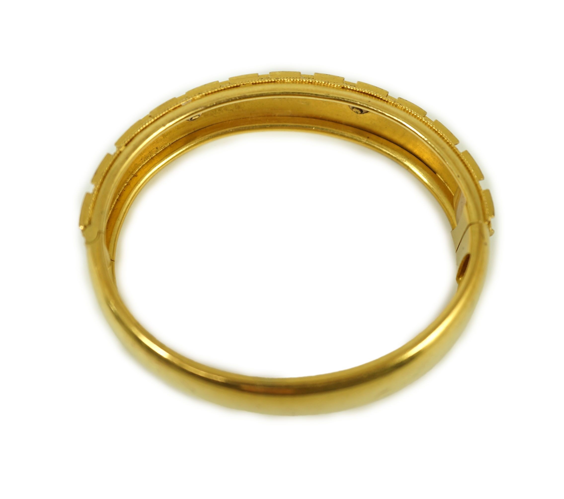 A late Victorian 15ct gold coral bead and seed pearl set part cannetile work hinged bangle